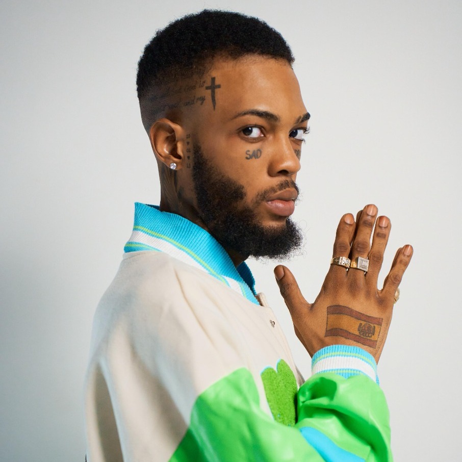 Roze Don in a varsity jacket, photographed in profile